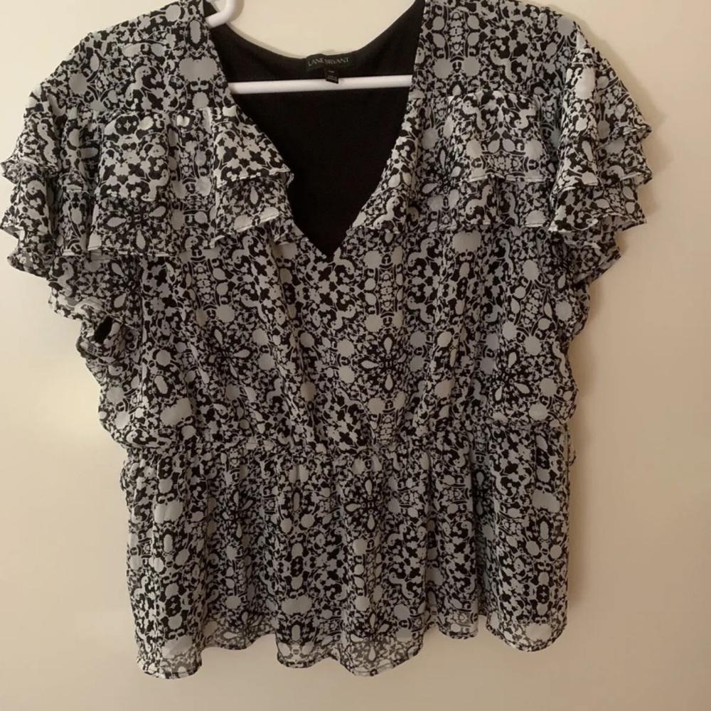 Lane Bryant ruffled top black and white size 24 little ties on the sides.